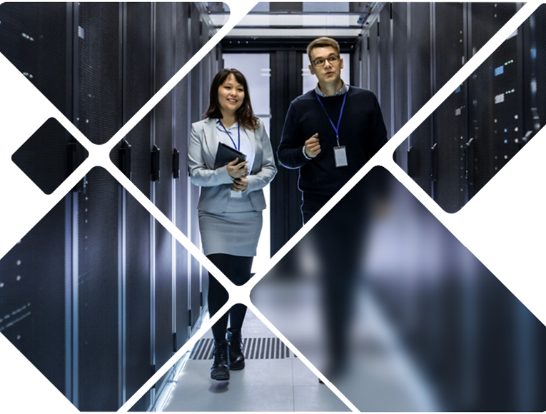 Man And Woman Walk Through Server Room