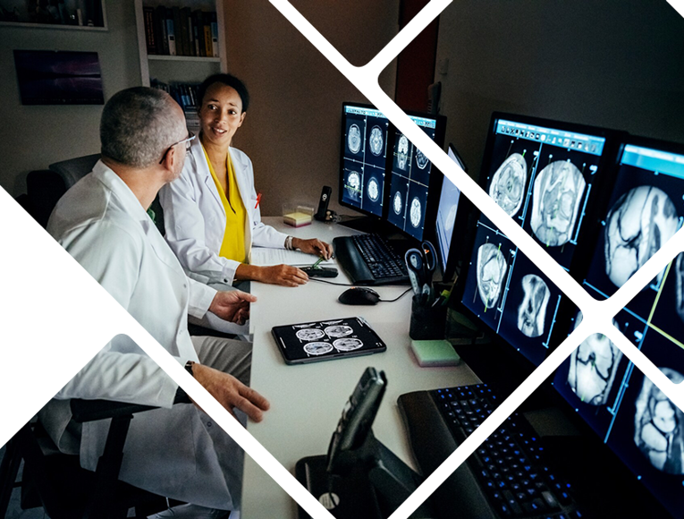Two Dr's review scans on high powered computer supplied with the latest technological software provided by CDW