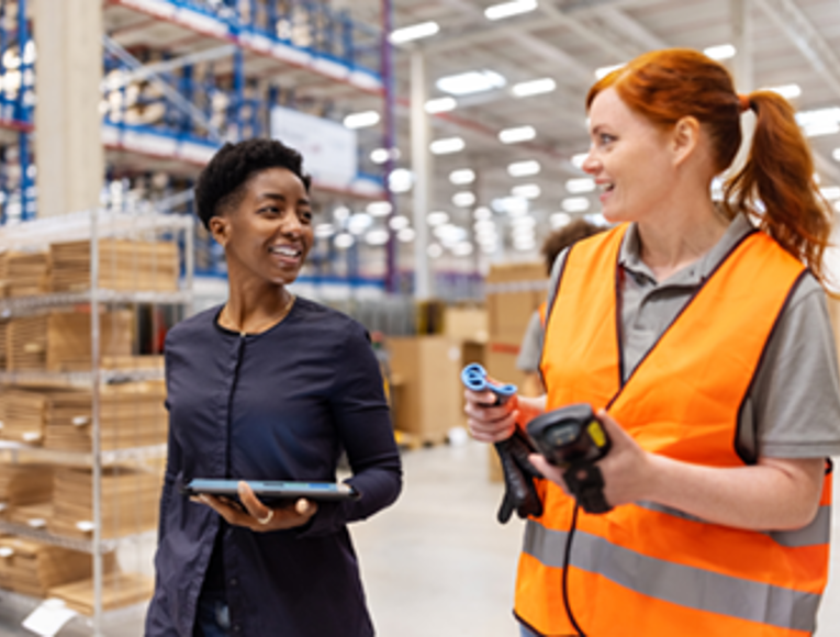 Two women working in CDW distribution centre