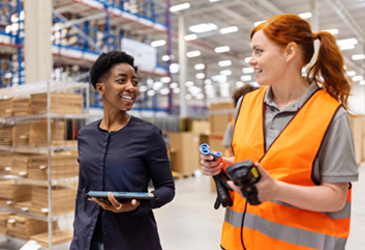 Two women working in CDW distribution centre